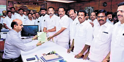 Karur AIADMK cadre, led by M R Vijayabhaskar, submitting the complaint to Karur Collector-cum-Election Officer G Ravikumar on Friday.