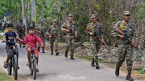 Border Security Force (BSF) personnel conduct a route march in Nadia.