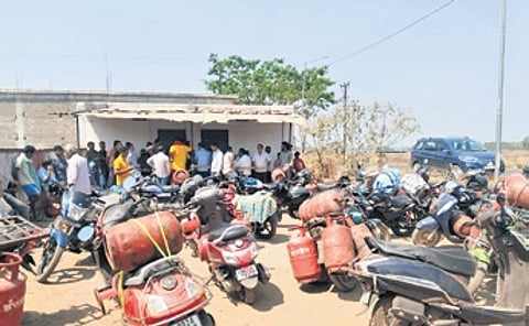 People line up in front of a gas agency in Nabarangpur.