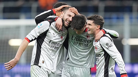 AC Milan's Strahinja Pavlovic, left, celebrates after scoring their side's first goal of the game during the Serie A soccer match between Milan and Torino in Milan, Italy, Saturday, March 21 , 2026.