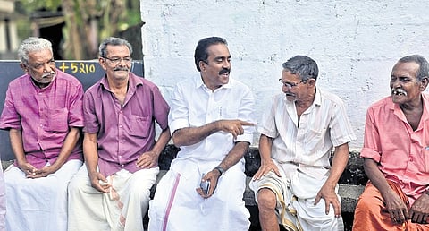 Sitting MLA and UDF candidate Anwar Sadath interacts with voters in Aluva.