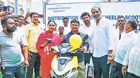 Minister Gottipati Ravi distributed 21 tri-wheel scooters to differently abled beneficiaries at the Municipal Office.