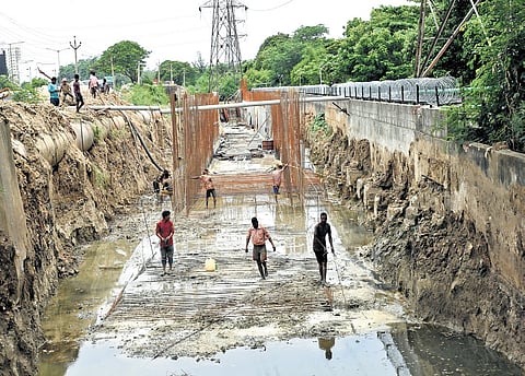 Workers undertaking stormwater drain construction work in Chennai.
