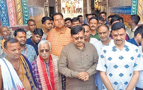 Law Minister Harichandan and temple officials addressing mediapersons in front of Srimandir on Monday