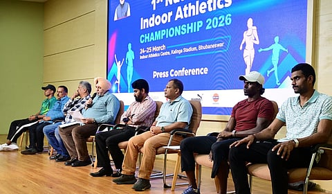 Athletics Federation of India officials and athletes during a press conference on Monday