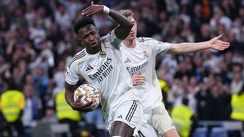 Real Madrid's Vinicius Junior celebrates after scoring his side's first goal the Spanish La Liga soccer match between Real Madrid and Atletico Madrid in Madrid, Spain, Sunday, March 22, 2026.