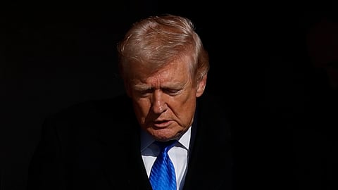 US President Donald Trump disembarks Air Force One upon his arrival at Joint Base Andrews, Md., Monday, March 23, 2026.