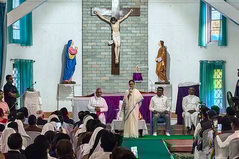 West Bengal Chief Minister Mamata Banerjee addresses the gathering during a visit to St Lucy Church, at Chalsa, in Jalpaiguri district, Tuesday, March 24, 2026.