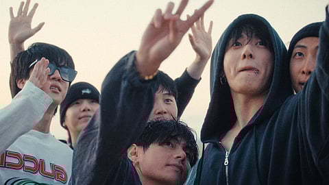 This image released by Netflix shows BTS members, from left, Jin, Suga, Jimin, V, Jung Kook, and RM in a scene from the documentary "BTS: The Return."