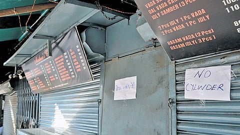A closed food outlet due to a shortage of commercial LPG cylinders.