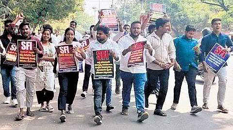 Students are seen carrying placards and raising slogans during a protest in front of the Assembly, in Hyderabad on Wednesday