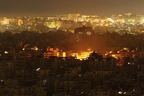 A flash from an explosion is seen during an Israeli strike targeting a building in Dahiyeh, Beirut's southern suburbs, Monday, March 23, 2026.
