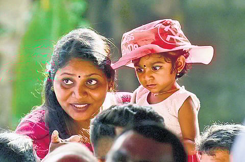 A mother tries to draw her child’s attention to Chief Minister Pinarayi Vijayan during the election campaign of LDF’s Tripunithura candidate K N Unnikrishnan