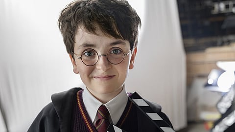 Dominic McLaughlin as Harry Potter on the sets of the series