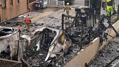 View at burnt ambulances in a car park at Golders Green in London, Monday, March 23, 2026 after an apparent arson attack on four vehicles belonging to a Jewish ambulance service, Hatzola Northwest.