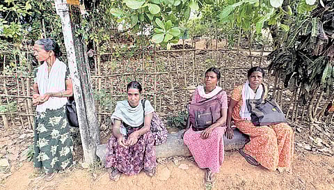 Tribal women waiting for KSRTC ‘Grama Vandi’ inside Aralam Farm after work