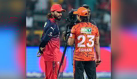 Royal Challengers Bengaluru skipper Rajat Patidar (L) with his Sunrisers Hyderabad counterpart Ishan Kishan during the toss in the IPL 2026 season opener.