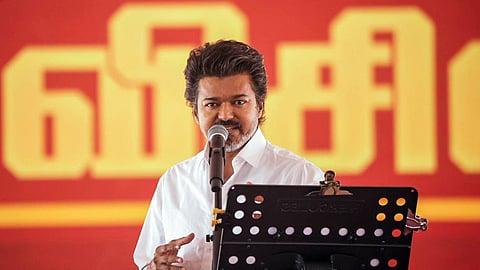 In this photo from Feb. 23, 2026, Tamilaga Vettri Kazhagam (TVK) president and actor Vijay addresses a party meeting in Vellore.