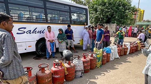 People queue up to avail LPG cylinders amid an ongoing supply crunch in Dilshad Colony, New Delhi, on Saturday, March 28, 2026.