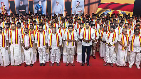 Tamilaga Vetri Kazhagam (TVK) President Vijay (C) with the party's candidates for the upcoming Tamil Nadu Assembly elections in Chennai on Sunday, March 29, 2026.