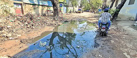 The roads inside the Vyasarpadi Cooperative Industrial Estate are not laid and are muddy with sewage overflow.