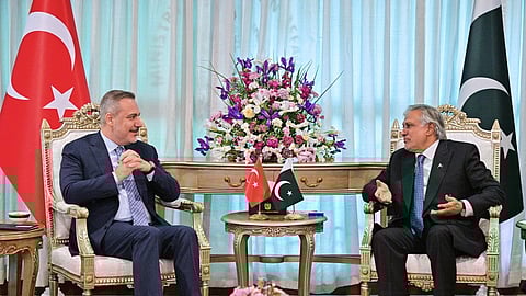 In this photo released by the Pakistan Ministry of Foreign Affairs, Turkish Foreign Minister Hakan Fidan, left, meets with his Pakistani counterpart Ishaq Dar in Islamabad, Pakistan, Sunday, March 29, 2026.