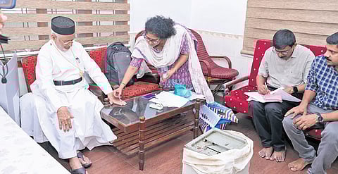 Fr Varghese Kallappara casting his vote at his residence at Nedumbassery