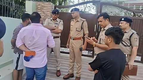 Police at the site where the retired army Brigadier was killed in a crossfire in a road rage incident.