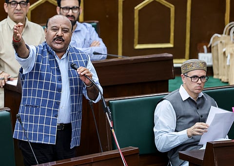 Jammu and Kashmir Deputy Chief Minister Surinder Kumar Choudhary, left, speaks during the Budget session of the J&K Assembly, in Jammu, Monday, March 30, 2026. J&K Chief Minister Omar Abdullah is also seen.