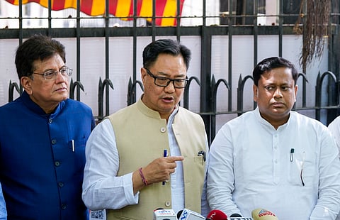Union Ministers Kiren Rijiju, center, Piyush Goyal, left, and Minister of State for Education Sukanta Majumdar, address the media at the Election Commission of India headquarters, in New Delhi, Monday, March 30, 2026.