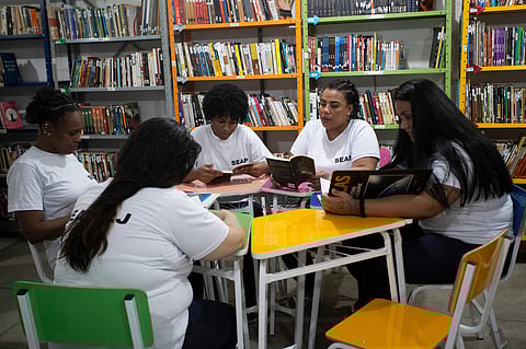 Incarcerated women read books in the library of the Djanira Dolores de Oliveira women's prison in Rio de Janeiro, Wednesday, March 25, 2026.