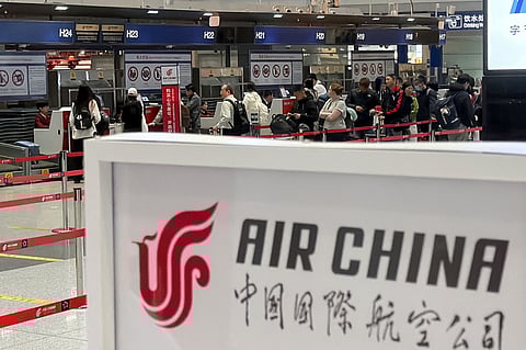 People line up in front of an Air China's counter for a direct flight between Beijing and North Korea's capital of Pyongyan, at Beijing Capital International Airport in Beijing Monday, March 30, 2026