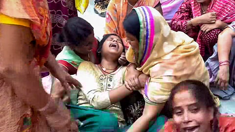 Relatives mourn at a hospital after a stampede at the Sheetla Mata temple, in Nalanda district, Bihar, Tuesday, March 31, 2026. At least eight women were allegedly killed in the incident following a heavy rush of devotees.