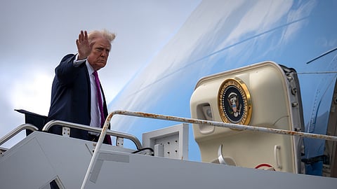 US President Donald Trump waves as he boards Air Force One, Sunday, March 29, 2026, at Palm Beach International Airport in West Palm Beach, Fla.