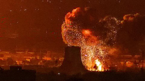 An explosion erupting following strikes near Azadi Tower close to Mehrabad international airport in Tehran