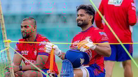 Lucknow Super Giants skipper Rishabh Pant (L) with batter Nicholas Pooran during a practice session in Lucknow.