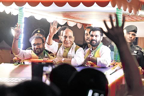Defence Minister Rajnath Singh and NDA candidates Yuvaraj Gokul (Nedumangad) and Vivek Gopan (Aruvikkara) during a roadshow at Pothencode.