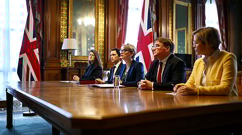 Britain's Foreign Secretary Yvette Cooper, center, speaks during a virtual summit at the Foreign & Commonwealth Office in London, on Thursday April 2, 2026, with around 35 countries to discuss ways of reopening the Strait of Hormuz.