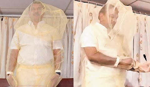 BRS MLA Devireddy Sudheer Reddy addresses a press conference while draped in a mosquito net on Thursday.