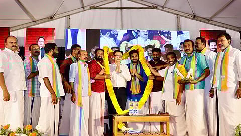 Union Minister Kiren Rijiju with BJP candidate from Kundara, Dr Robin Radhakrishnan, and other party officials during a poll rally in Kerala.