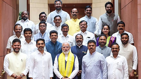 PM Narendra Modi giving a pose to a photo along with Minister for IT Nara Lokesh and NDA MPs Ministers at the Parliament on Thursday