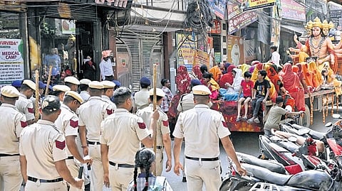 Security heightened during the procession at Uttam Nagar JJ Colony.