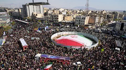Mourners gather during a funeral procession for Alireza Tangsiri, head of Iran's Islamic Revolutionary Guard Corps Navy, and others killed in Israeli strikes in late March, in Tehran, Iran, Wednesday, April 1, 2026.