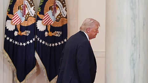 US President Donald Trump departing after his address from the White House's Cross Hall on Wednesday