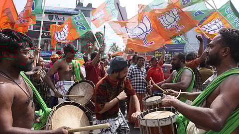 Jubilant NDA workers celebrate their victory in Thiruvananthapuram Corporation in front of the counting center at Mar Ivanios College on Saturday.
