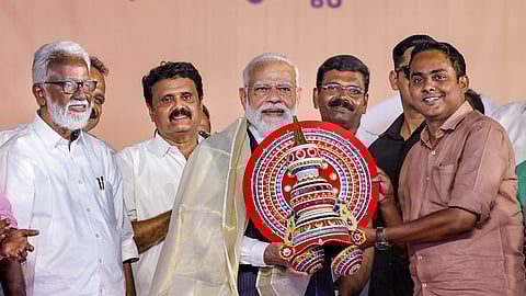 Prime Minister Narendra Modi being felicitated during a public meeting ahead of the Kerala Assembly elections, in Thiruvalla, Kerala.