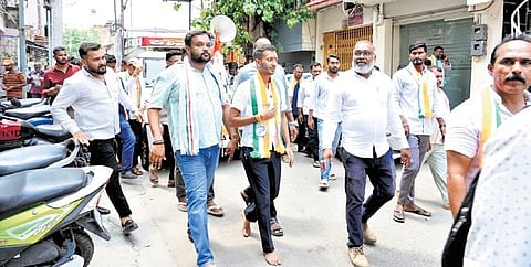 Congress candidate for Davanagere South Samarth Shamanur walks barefoot while campaigning in the city