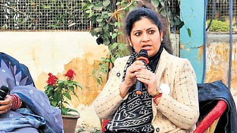 Professor-turned-transgender rights activist Preeti Choudhary (L) speaks at an event.
