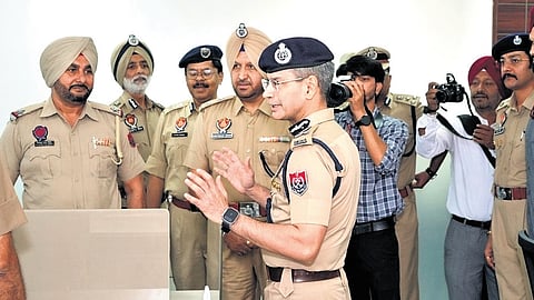 Punjab Director General of Police Gaurav Yadav (C) speaks with officials and media persons.