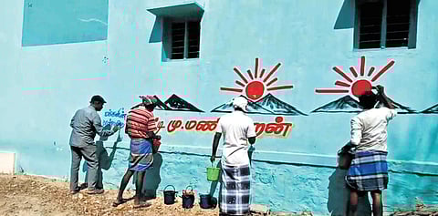 Artists painting walls for polls in rural parts of Thirumangalam in Madurai
